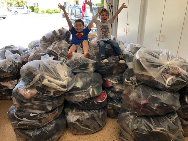 Happy kids with a shoe collection