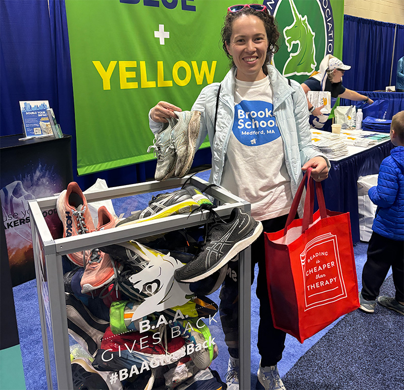 Woman donating shoes at Boston Marathon