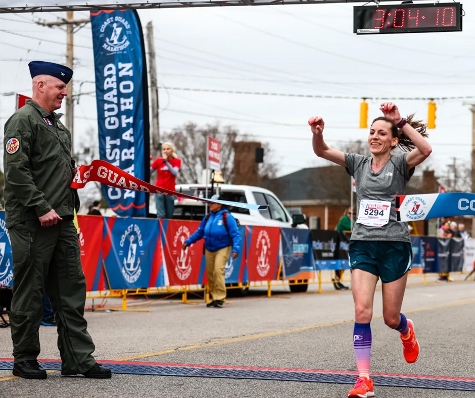 Woman finishing the Coast Guard Marathon