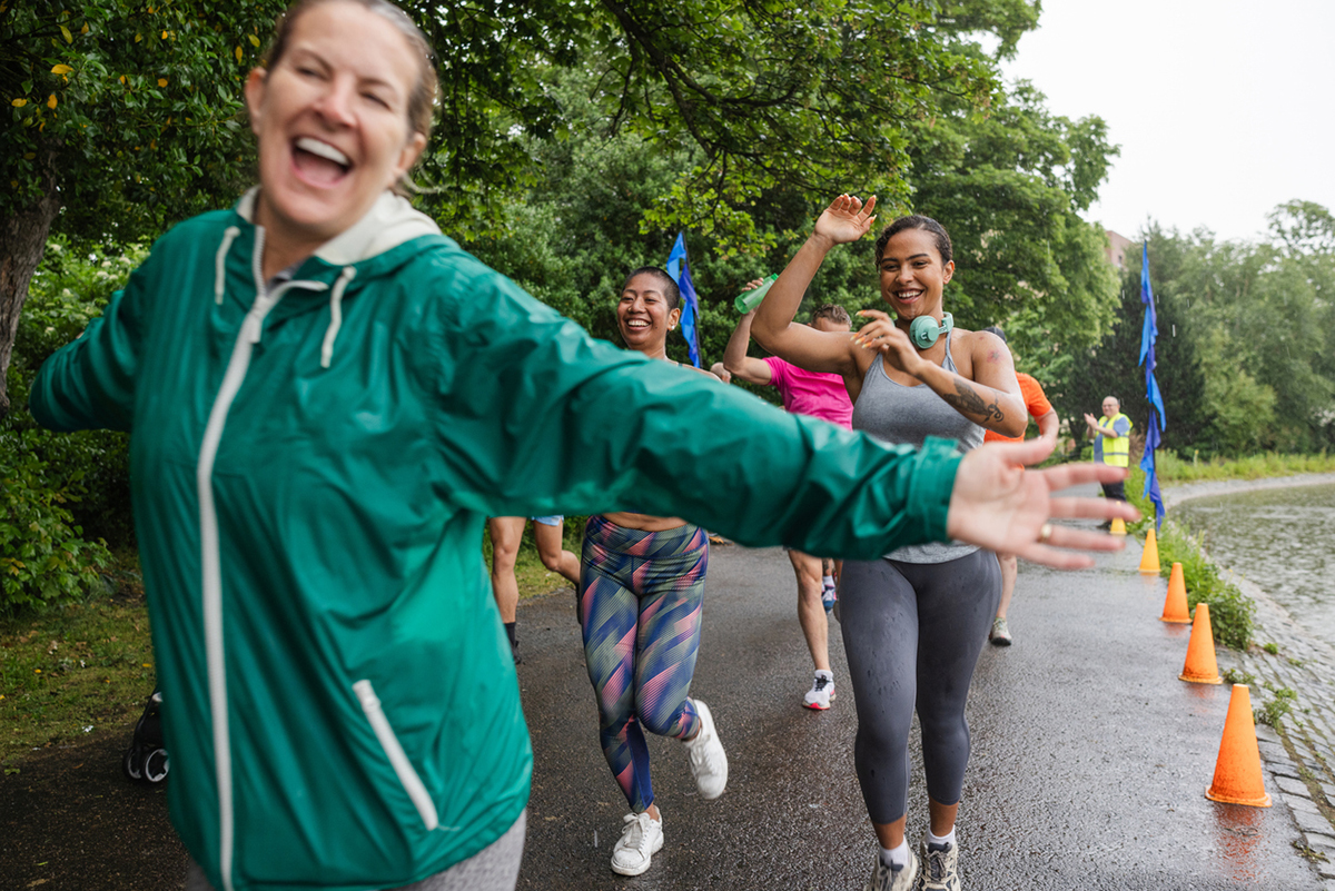 a group of runners running for a charity at a race.