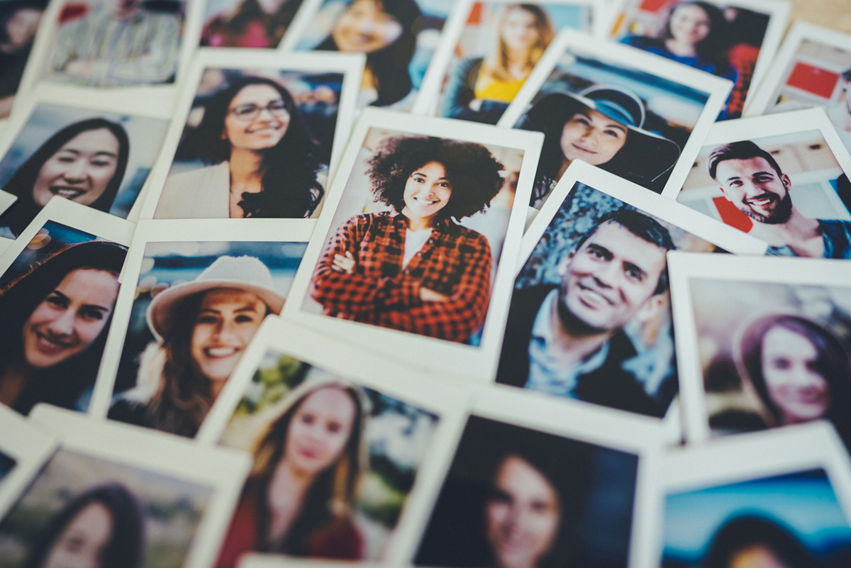 Photo wall of customer appreciation photos.