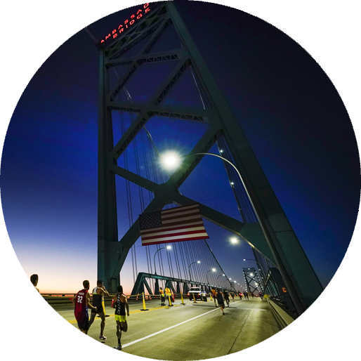Early morning over the Ambassador Bridge as Detroit Free Press Marathon runners begin their race.