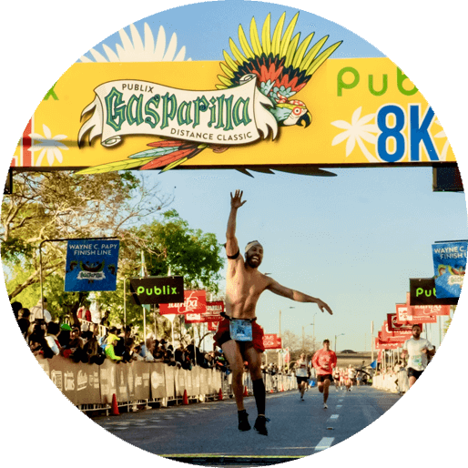 Sunday race winner crossing the finish line at the Run Gasparilla Distance Classic.