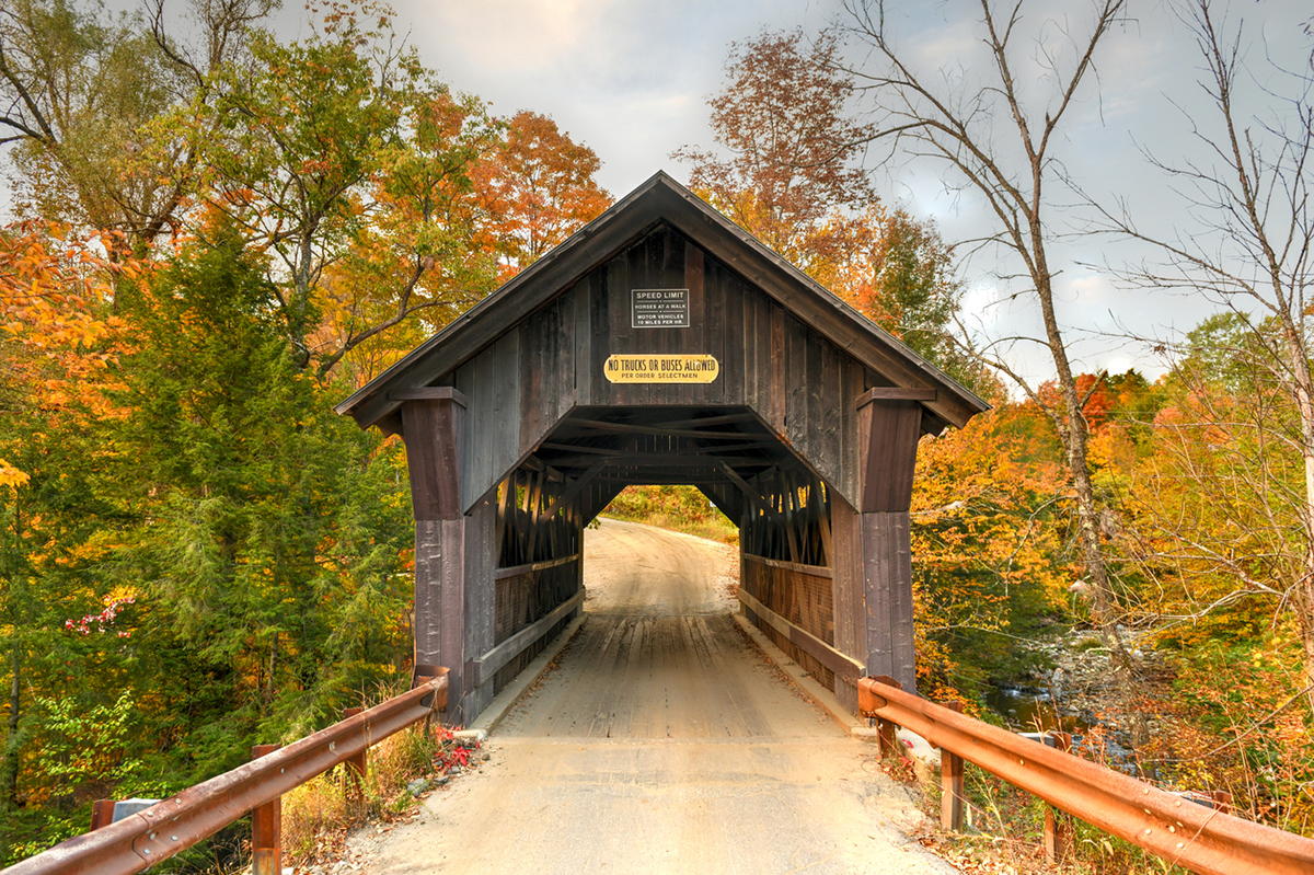 Rural Vermont Covered Bridge by the name of Gold Brook in Stowe, Vermont, USA