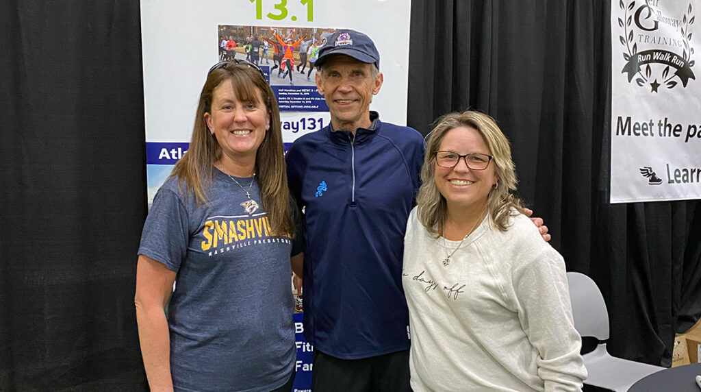 Team member poses with Jeff Galloway.