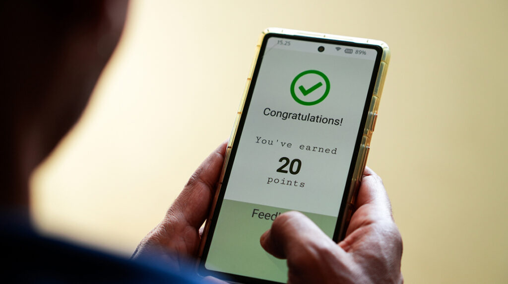A customer views loyalty points on their phone.