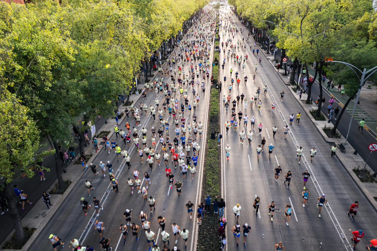 Aerial view of runners participating in an organized marathon event.