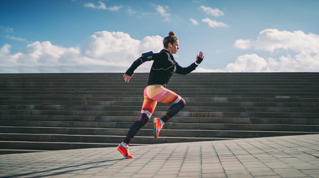 A runner is running on an incline to increase running endurance.